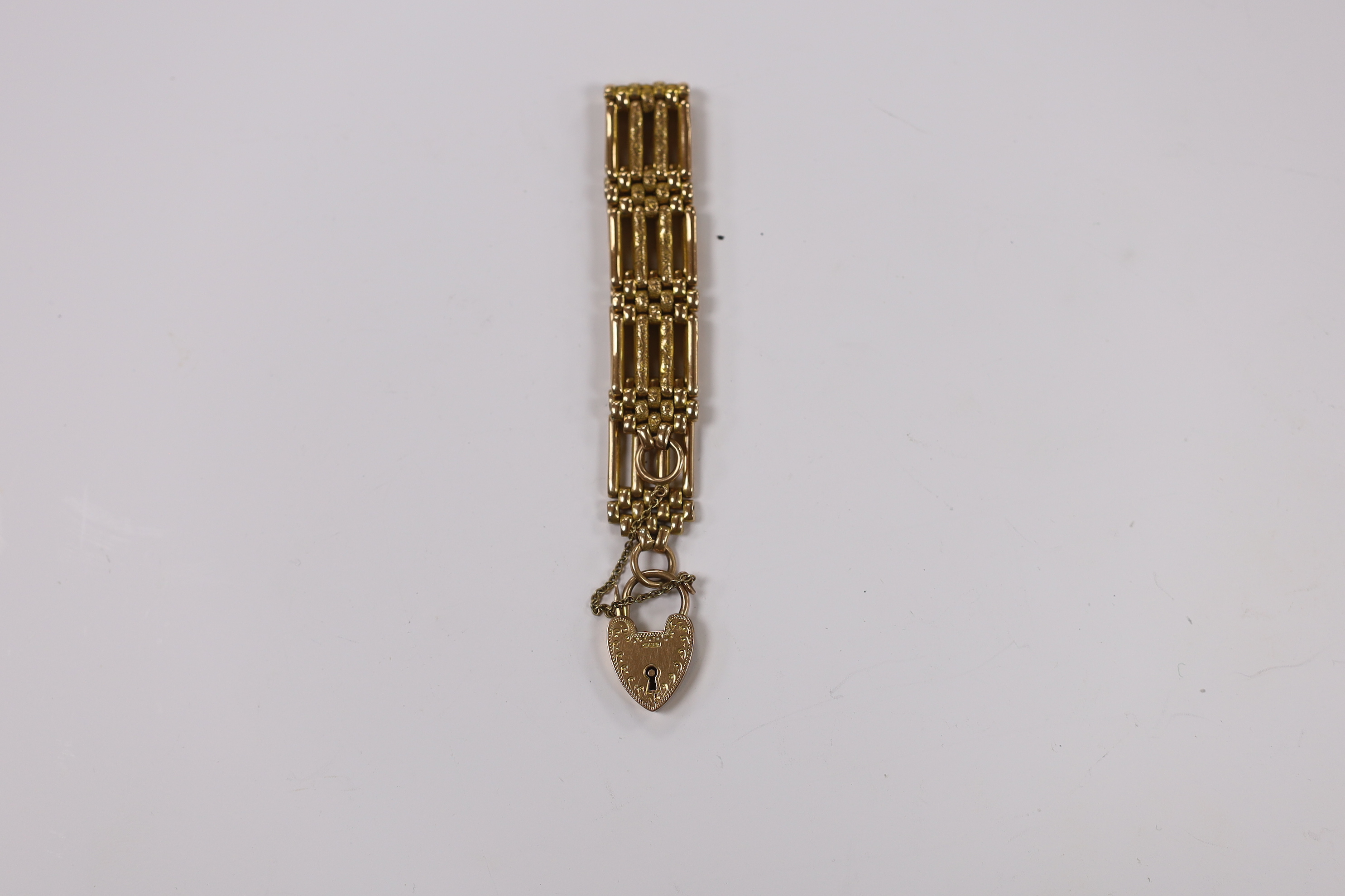 An early 20th century 9ct gate link bracelet, with heart shaped padlock clasp, 18cm